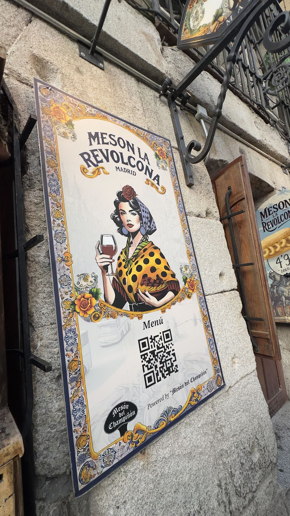 The tavern’s front on Cava de San Miguel, with the chulapa poster