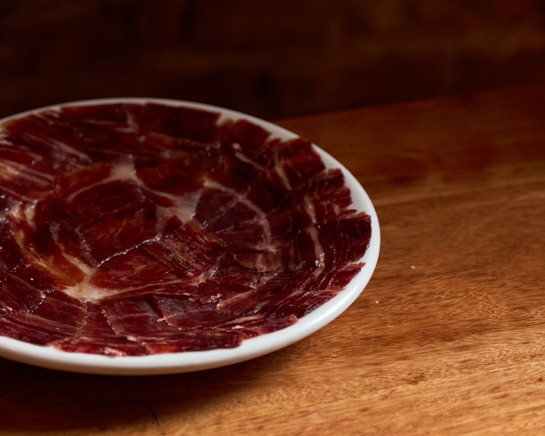 Plate of hand-carved Iberian jamón