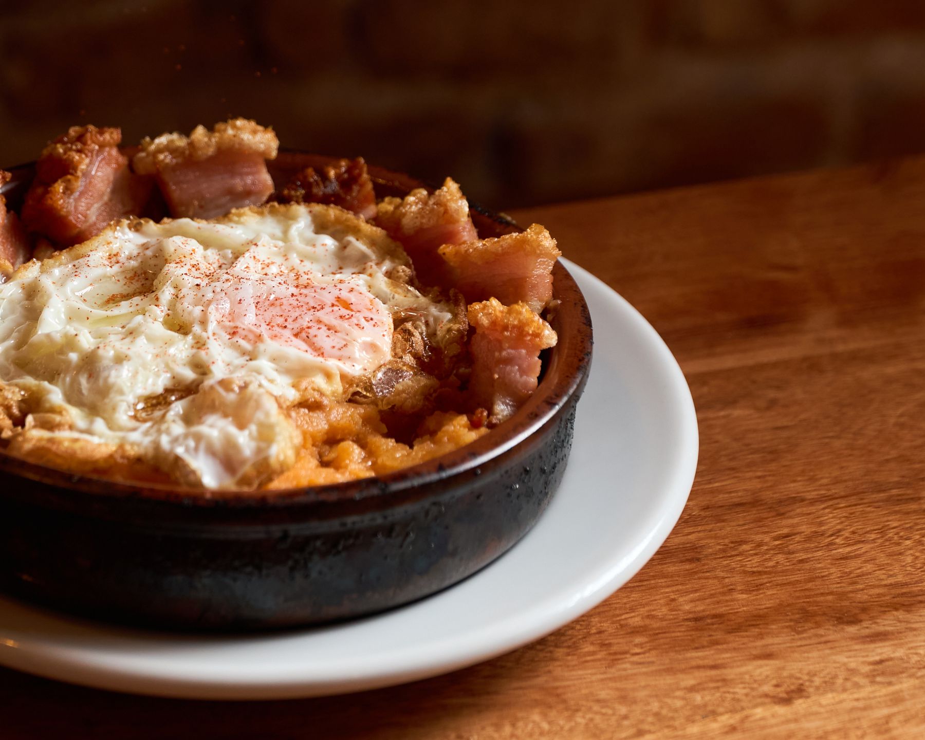 Revolconas potatoes with egg and crispy pork belly